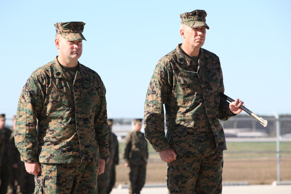 Sgt. Maj. Scott D. Grade, left, and Sgt. Maj. Christopher J. Campbell stand before the commanding officer of Marine Unmanned Aerial Vehicle Squadron 2 during VMU-2’s relief and appointment ceremony Nov. 18. The sergeants major exchanged the noncommissioned officers sword marking the end of one leadership and the beginning of another.