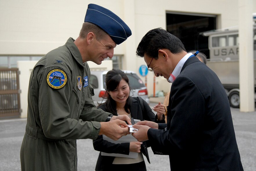 U.S. Air Force Col. Corey Martin, 18th Wing vice commander, greeted leaders of the Liaison Council of Defense-related Kyushu-Okinawa Prefectural and City Assemblies, a pro-United States group, to Kadena Air Base, Japan, Nov. 17, 2011. The group consists of roughly 76 members from both Okinawa and Kyushu and visited Kadena to receive an 18th Wing mission briefing, along with a base tour. (U.S. Air Force photo by Airman 1st Class Tara A. Williamson/released)