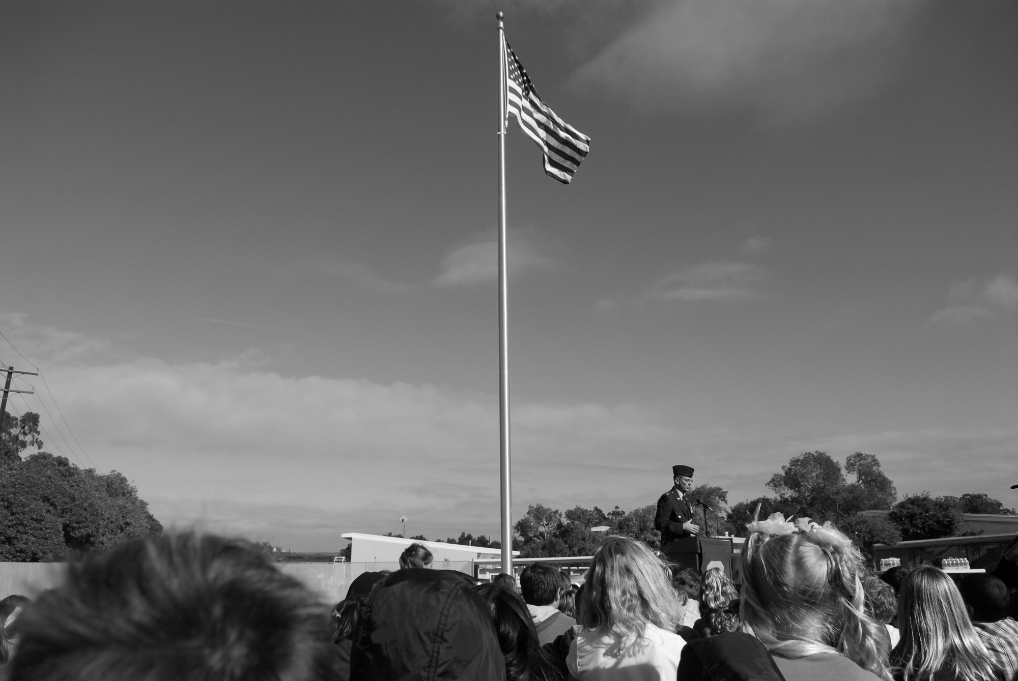 VANDENBERG AIR FORCE BASE, Calif. - Vandenberg's Crestview Elementary School students listen as Col. Keith Balts, 30th Space Wing vice commander, talks about the symbolism of the American flag at the school’s flagpole dedication ceremony here Friday, Nov. 18, 2011. The new flagpole replaced the school’s old one, which was in poor shape. (U.S. Air Force photo/2nd Lt. Austin Fallin)