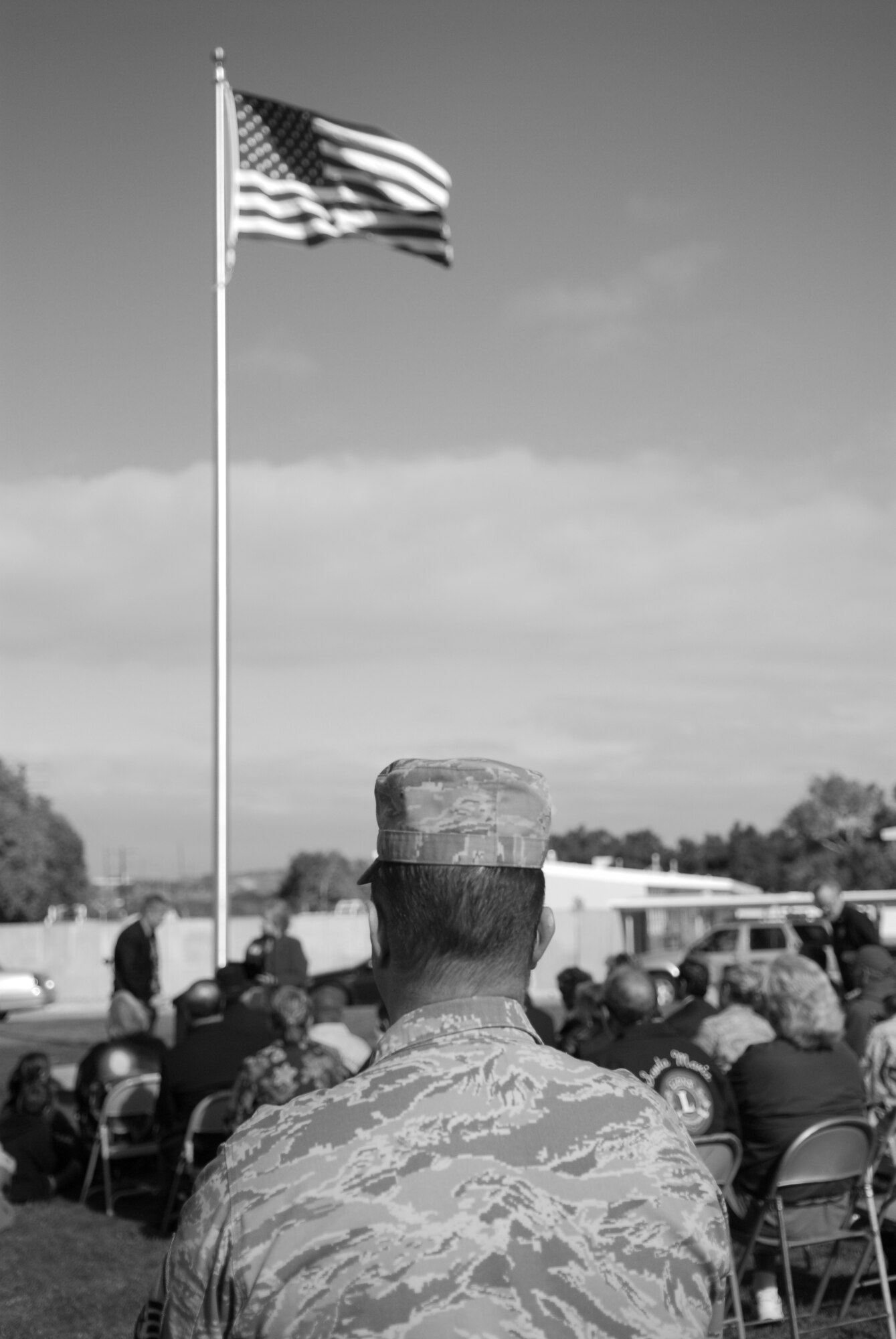 VANDENBERG AIR FORCE BASE, Calif. - Master Sgt. John Peters, of the 30th Space Wing, watches the flagpole dedication ceremony at Crestview Elementary School here Friday, Nov. 18, 2011. Various organizations, both on and off Vandenberg, raised funds for the flagpole. (U.S. Air Force photo/2nd Lt. Austin Fallin)