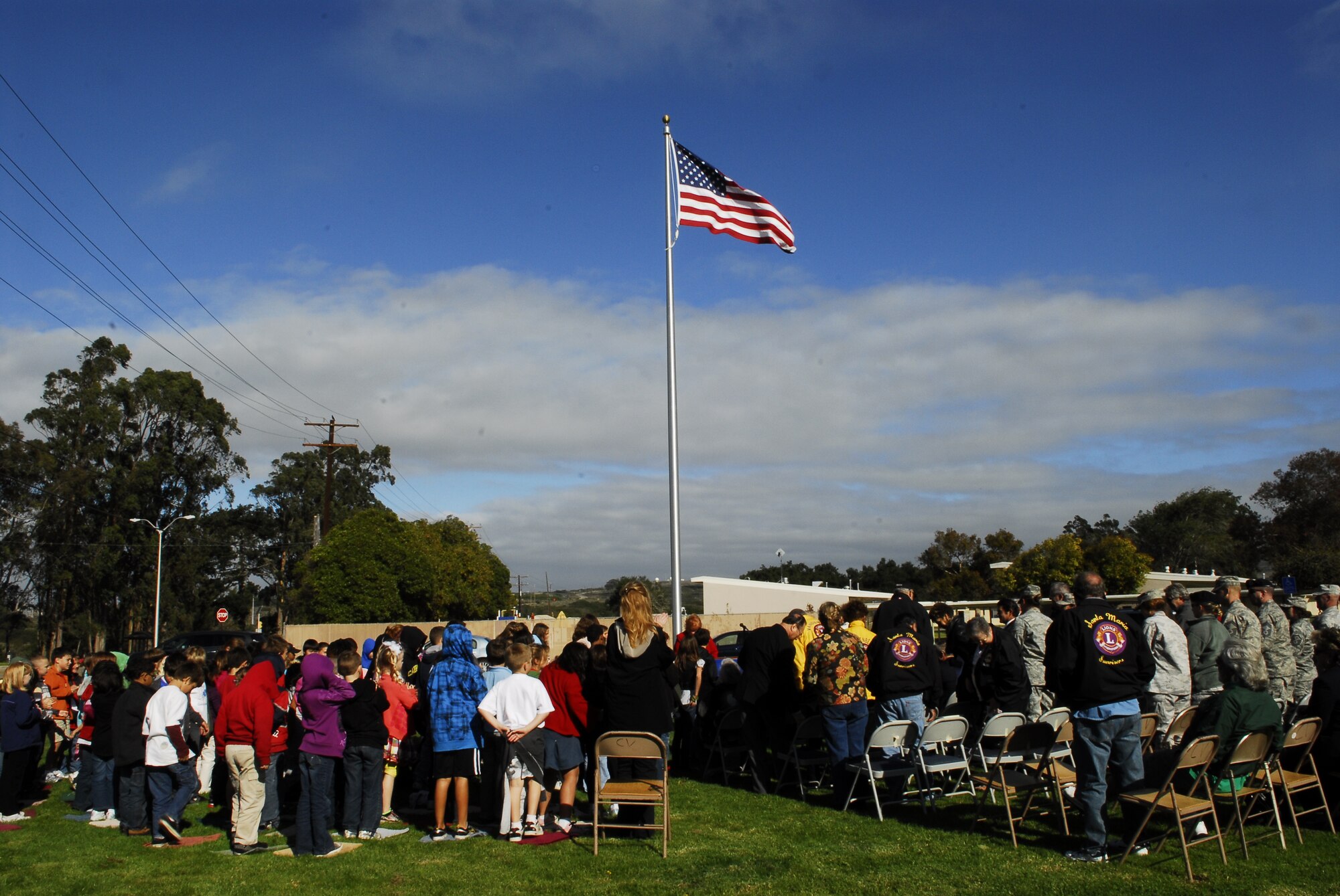 VANDENBERG AIR FORCE BASE, Calif. - Vandenberg's Crestview Elementary School students and guests stand outside of the school to recognize all who made their flagpole dedication ceremony possible here Friday, Nov. 18, 2011. Various organizations, from both Vandenberg and local communities, worked to raise funds for the flagpole. (U.S. Air Force photo/2nd Lt. Austin Fallin) 