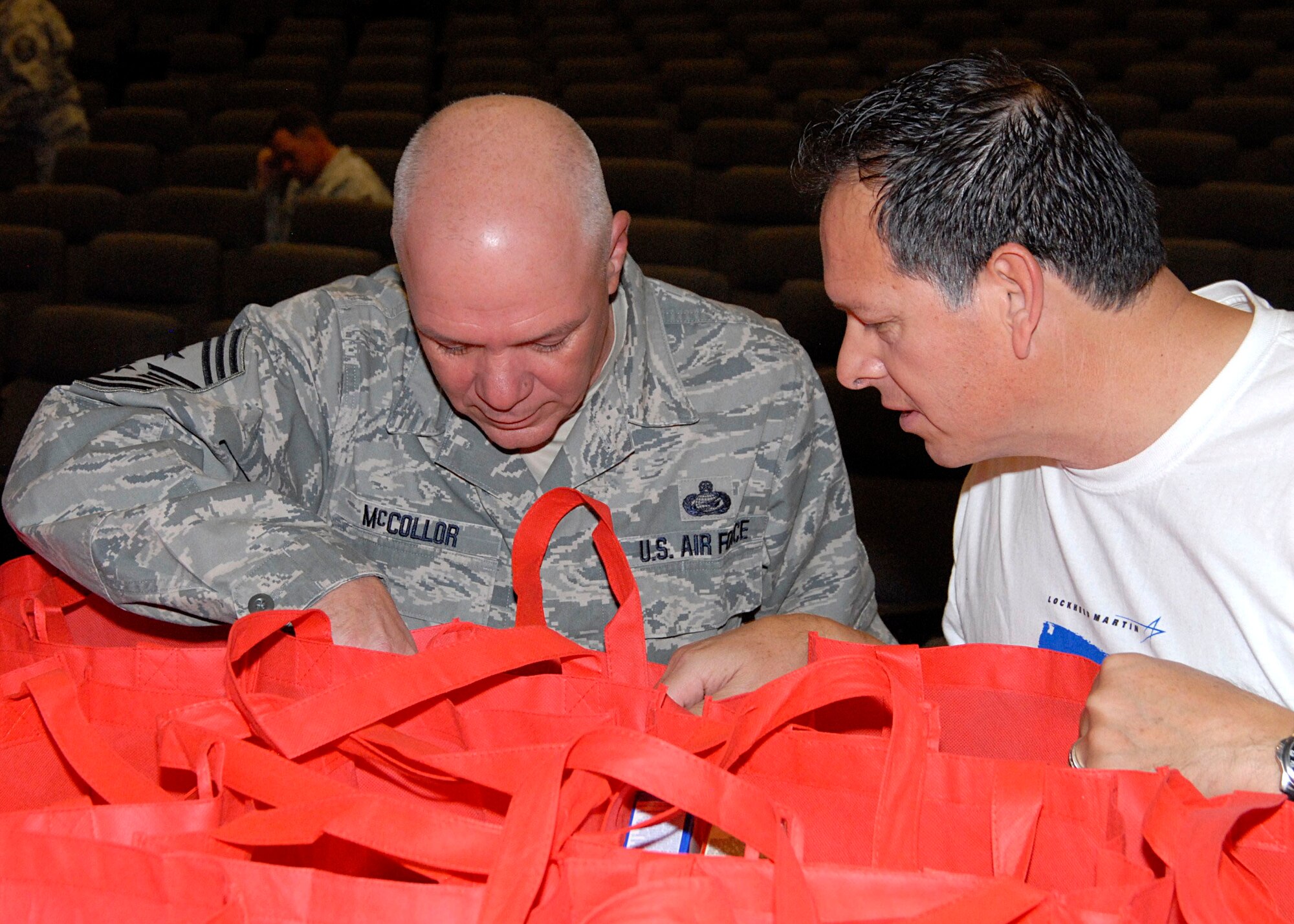 Chief Master Sgt. Chris McCollor checks out the goodies Airmen received on Nov. 9 at the Thanks for Giving Edwards AFB event. The chief, first sergeants, and other leaders at the base helped connect Edwards Airmen with the generous community donation being offered to them by Operation Homefront Southern California.  (U.S. Air Force Photo by Laura Mowry)
