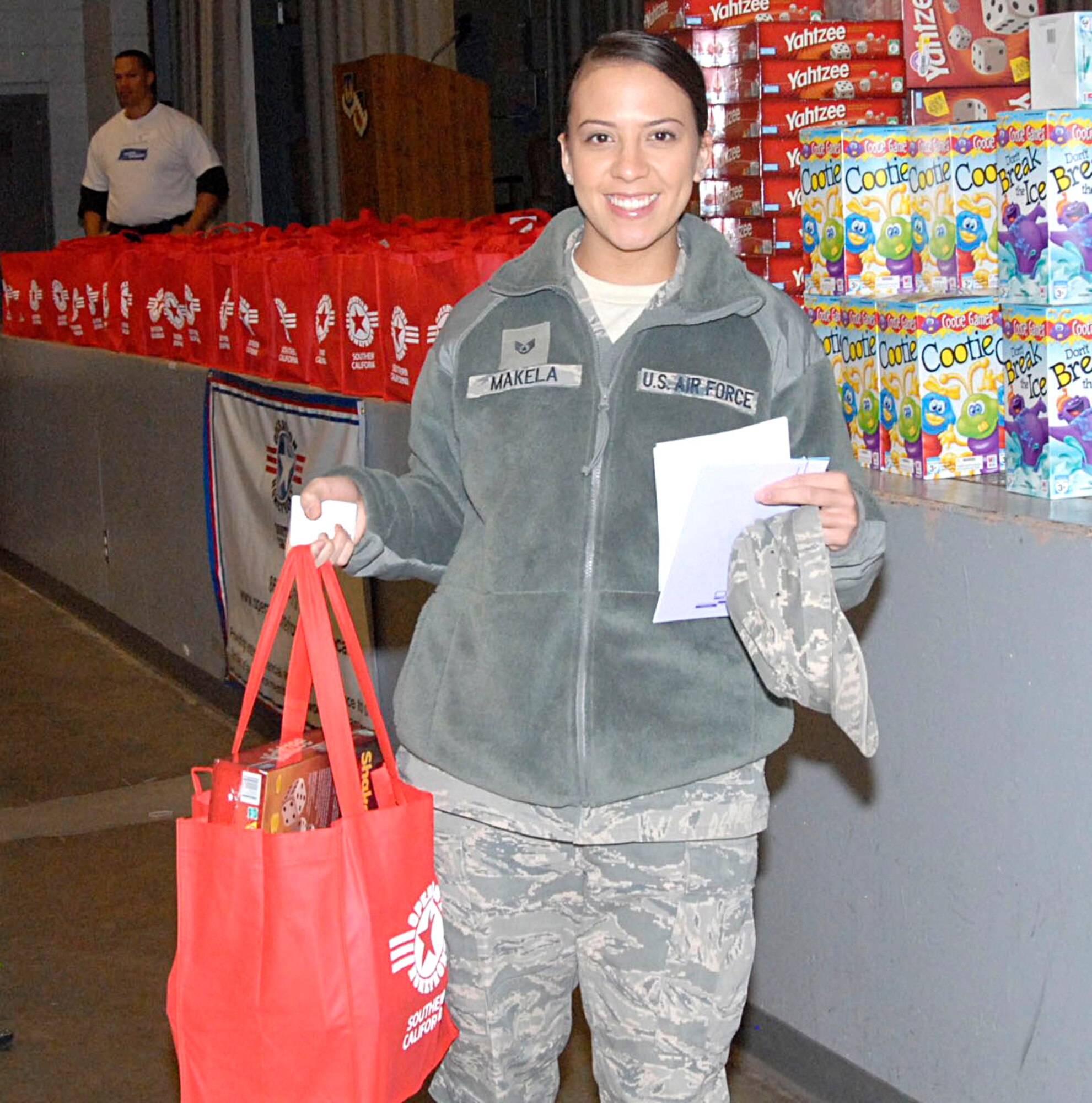 Staff Sgt. Evelyn Makela was one of 200 Airmen who picked up Thanksgiving baskets at the base theater on Nov. 9. Operation Homefront Southern California teamed up with the Edwards First Sergeants Council and Lockheed Martin to extend a helping hand to service members this holiday season. (U.S. Air Force Photo by Laura Mowry)