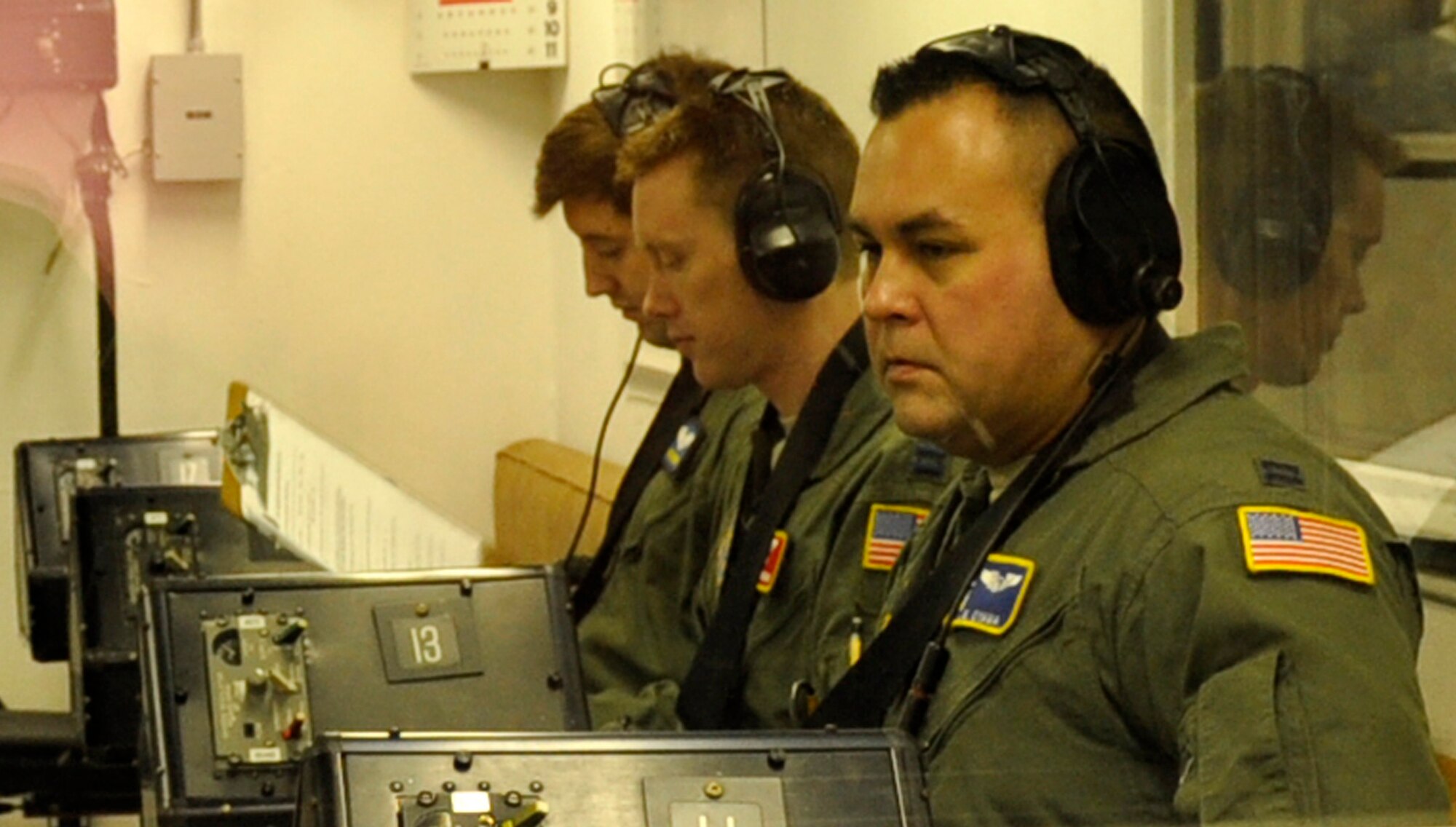 Capt. Joel Oyama, 446th Aeromedical Evacuation Squadron flight nurse (right), awaits instructions in the high-altitude chamber at the Aviation Survival Training Center, Naval base Whidbey Island, Wash., Nov. 9, 2011. ASTC is where Team McChord aircrew members currently receive their high-altitude chamber refresher training. (U.S. Air Force photo/Master Sgt. Jake Chappelle)