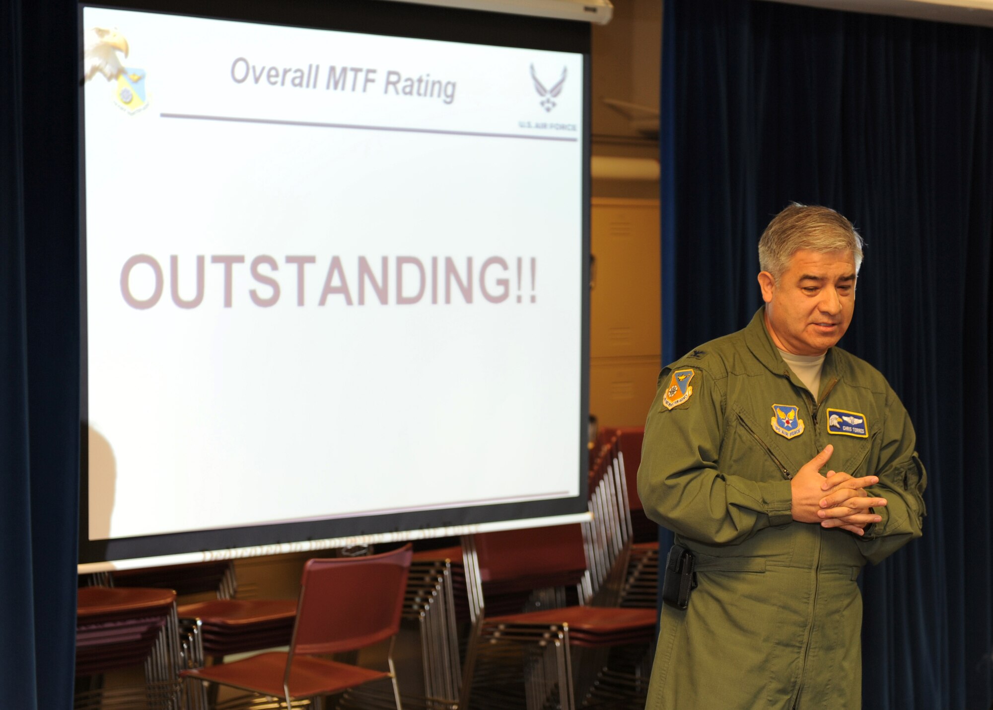 Col. Chris Torres,  Air Force Inspection Agency Medical Directorate lead inspector, speaks to McConnell’s medics during the medical Health Services Inspection out-brief Nov. 18, 2011, McConnell Air Force Base, Kan.  The 22nd Medical Group achieved an “Outstanding,” highest score ever on the HSI rating.  (U.S. Air Force photo/ Airman 1st Class Maurice Hodges)