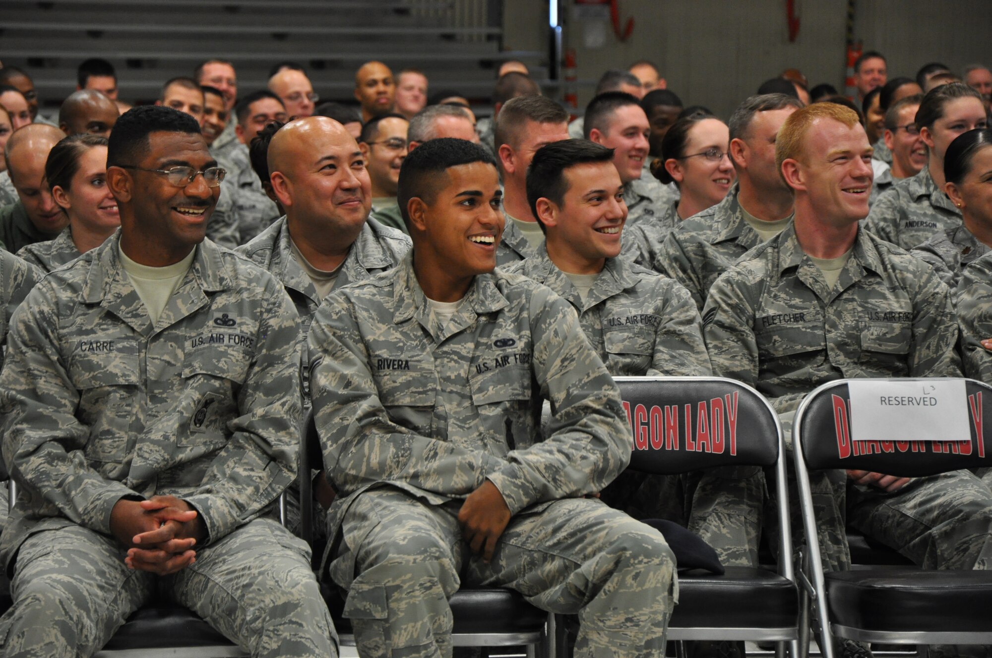 Airmen react during the Happy Hour comedy tour featuring comedian Bernie McGrenahan at Beale Air Force Base, Calif., Nov. 16, 2011. McGrenahan’s show uses comedy and his personal experiences to send a message to Airmen of don’t drink and drive.