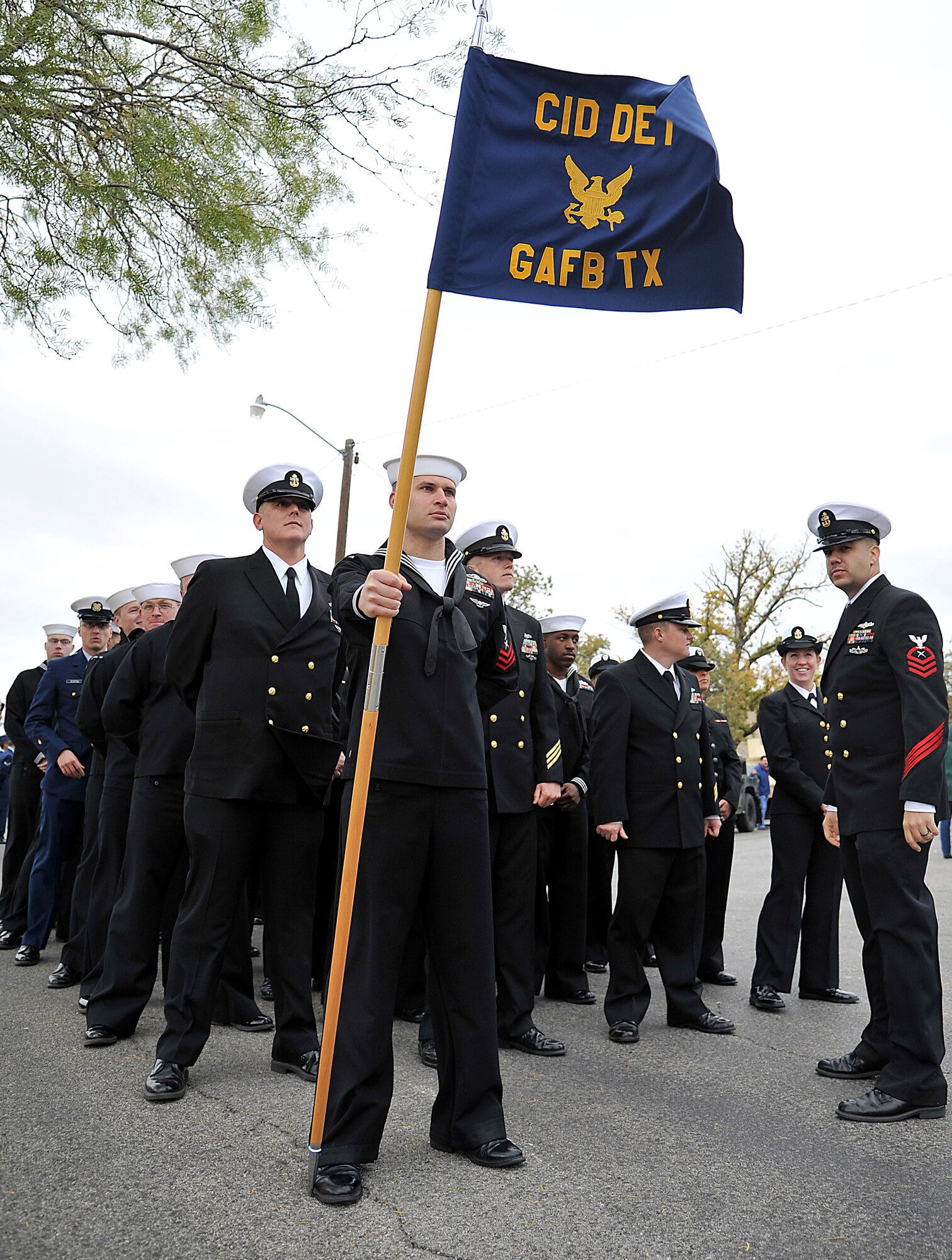 SAN ANGELO, Texas -- Sailors from the Navy Center for Information Dominance Detachment at Goodfellow Air Force Base form up for the annual Hunt for Heroes parade in downtown San Angelo Nov. 18.  The parade pays tribute to 25 wounded Iraq and Afghanistan combat veterans, which includes a West Texas hunting trip as well as numerous other events and activities. (U.S Air Force photo/Airman 1st Class Michael Smith)