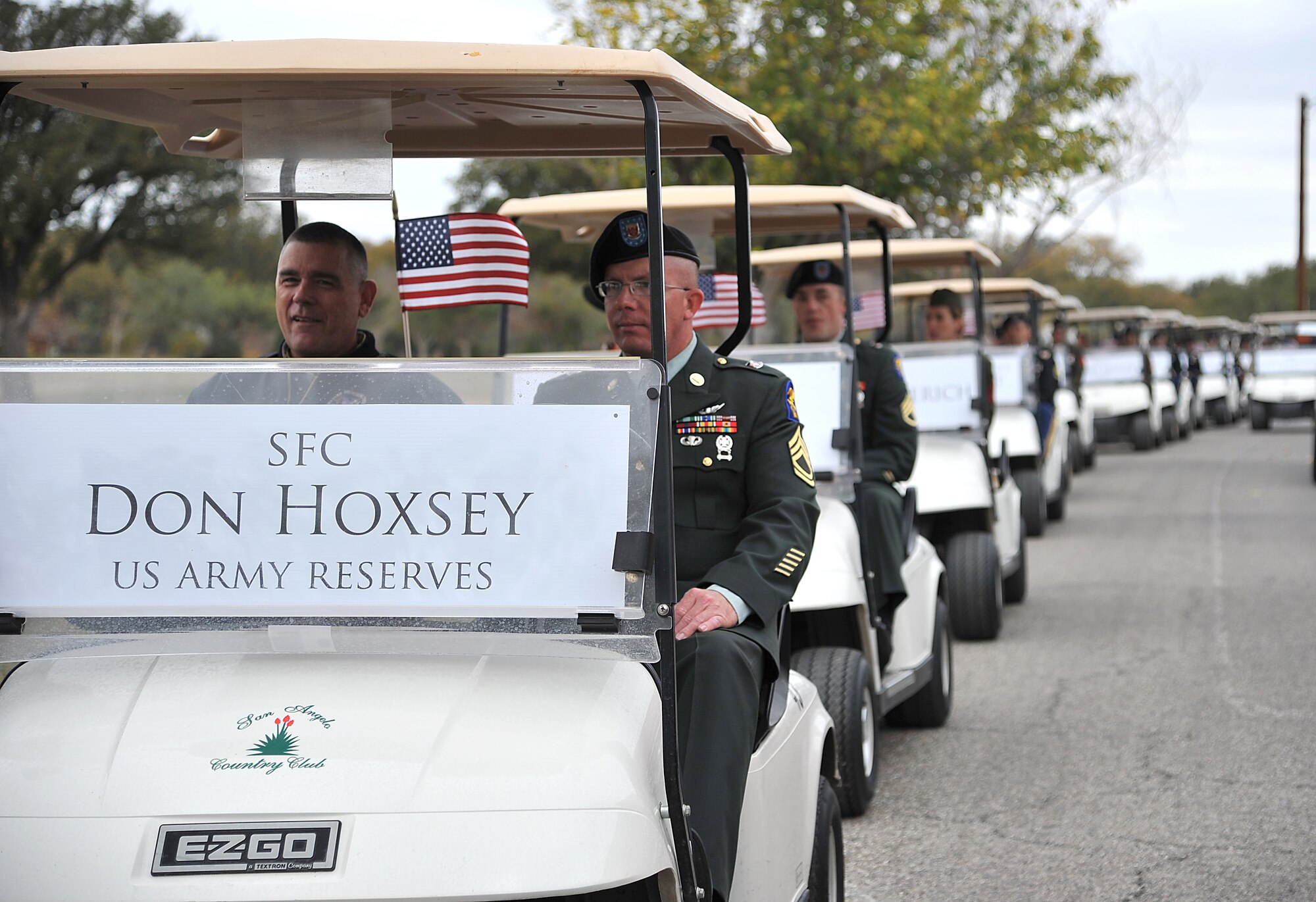 SAN ANGELO, Texas -- (From left:) Army Sgt. 1st Class Don Hoxsey is escorted by Army Sgt. 1st Class Thomas Holliday, 344th Military Intelligence Battalion, down the parade route during the annual Hunt for Heroes parade in downtown San Angelo along Park Drive Nov. 18.  The parade pays tribute to 25 wounded Iraq and Afghanistan combat veterans, which includes a West Texas hunting trip as well as numerous other events and activities. (U.S Air Force photo/Airman 1st Class Michael Smith)