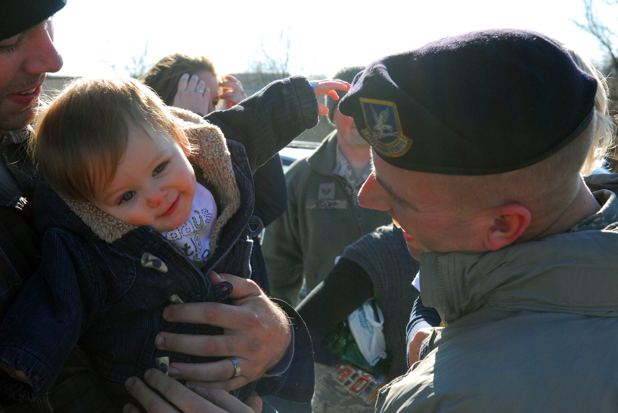 Five members of the 171st Security Forces Squadron serving with POMLT 2, a police operational mentor and liaison team, returned from Afghanistan today. Deployed for nearly a year, they were greeted by family members, friends and fellow Airmen.  (National Guard photo by Tech. Sgt. Stacy Gault)