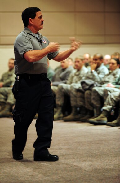 Ronny Garcia, Stay Alive From Education presenter, speaks to Airmen about traumatic car accidents involving drugs and alcohol during the Street Smart presentation Nov. 17, 2011, McConnell Air Force Base, Kan. Presenters Garcia , Tampa, Fla., fire and rescue captain, and Greg McCarty, retired lieutenant with Tampa fire and rescue,are part of a ten person traveling team based out of Florida. The presenters travel worldwide, educating more than 100,000 people a year. (U.S. Air Force photo/Senior Airmen Courtney Witt)