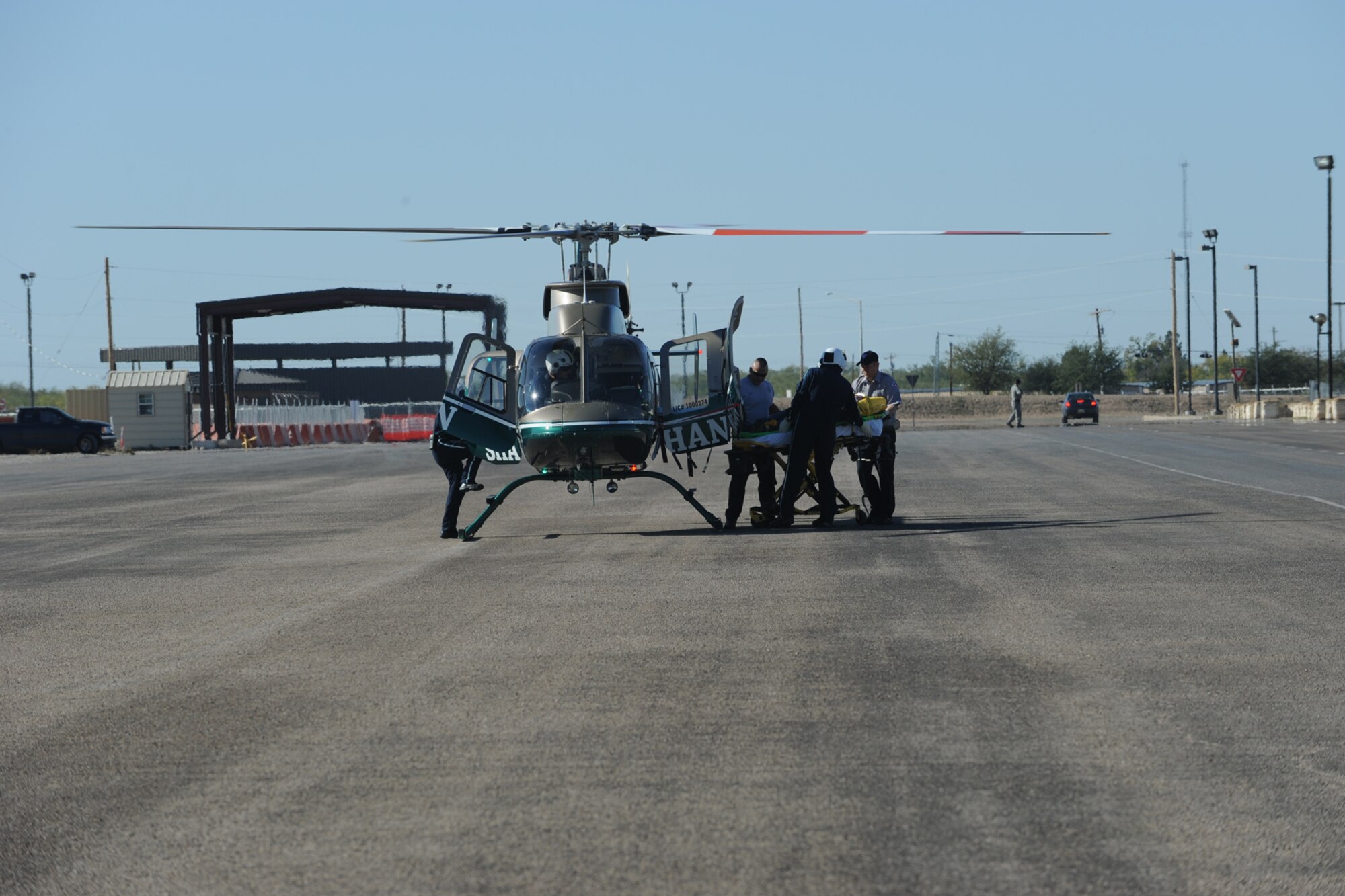 GOODFELLOW AIR FORCE BASE, Texas – Emergency Medical Technicians from Shannon Medical Center in San Angelo load a simulated casualty of Exercise Scarlet Hawk 11-12 into the medivac helicopter, Nov. 16. Ambulatory services were provided by local emergency services.   (U.S. Air Force photo/Staff Sgt. Laura R. McFarlane)