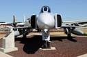 The F-4D Phantom II in the Tinker Air Force Base Heritage Airpark, serial number 66-7518, represented the Air Force mission since 1966. “Miss Piggy,” as its last unit dubbed this F-4D, has been both a tool for strategists in war and educators in peace.  The Air War College teaches that achieving air superiority over an enemy is crucial to winning a ground war. A versatile aircraft can help accomplish that goal. The aircraft manufacturer, McDonnell Douglas, intended the F-4 Phantom II to be such an aircraft. Originally designed for the Navy as a carrier-based fighter aircraft, the two-seater Phantoms were also qualified for land-based operations and entered operational service for the Air Force on May 27, 1963. Two years later, they had become the primary air superiority fighter for USAF in Southeast Asia, flying close air support and battlefield air interdiction missions.
