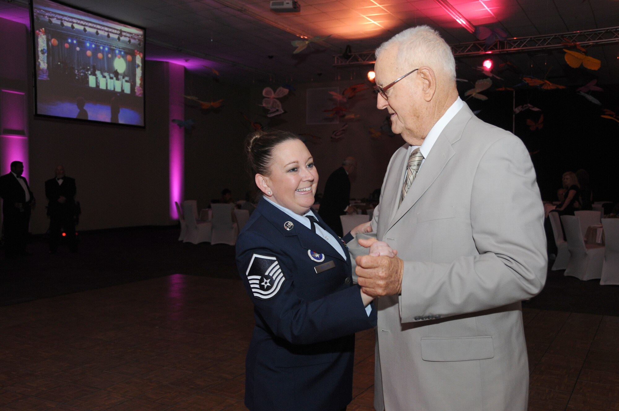 Master Sgt. Rhonda Polanco, 336th Training Squadron, Keesler Air Force Base, Miss., dances with Bill Williams, Air Force retiree, during the fifth annual Mississippi Gulf Coast Senior Prom at the IP  Casino Nov. 17, 2011.   Keesler Airmen volunteered for the event, sponsored by the Harrison County Development Commission and the Gulf Coast Retiree Partnership with more than 800 people in attendance.  (U.S. Air Force photo by Kemberly Groue)