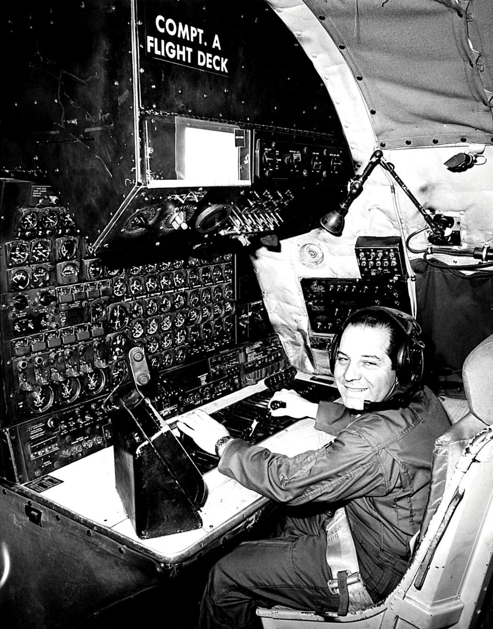 Retired Senior Master Sergeant Henry Costello poses for a photo while
working as a flight engineer in the cockpit of the C-124 Globemaster. Along
with the C-124s, Costello also worked on C-46 Commandos, C-119 Flying
Boxcars, C-123K Providers, and the C-130A Hercules during his time at the Pittsburgh
International Airport Air Reserve Station. He worked as a crew chief,
flight engineer, and hydraulic shop supervisor here before retiring in 1990. (U.S. Air Force Courtesy Photo)
