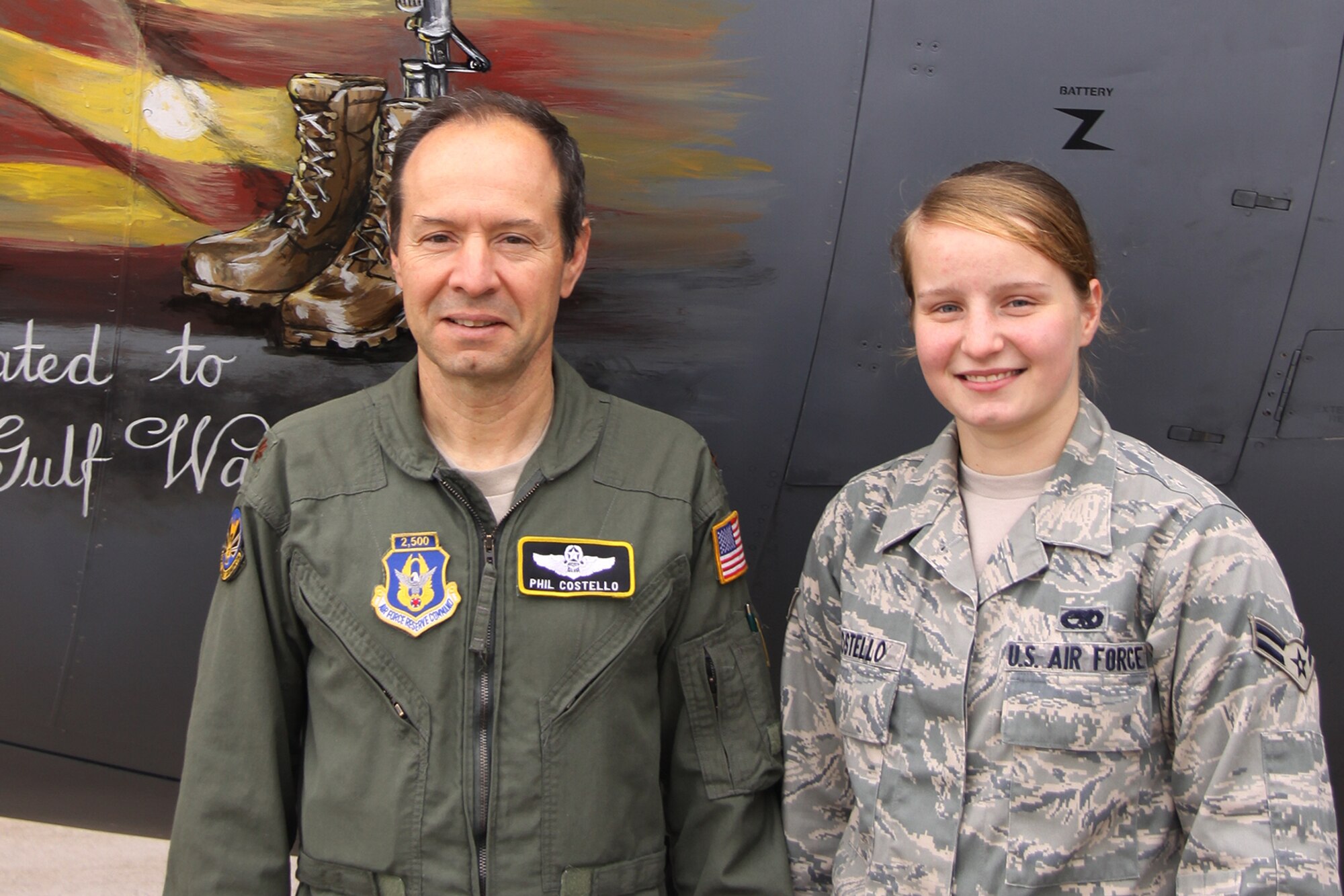 Maj. Phillip Costello, 758th Airlift Squadron, and his daughter, Airman 1st
Class Christy Costello, 911th Maintenance Squadron, stand together in front
of a C-130 Hercules aircraft, Nov. 16. The Costello family's membership to
the 911th spans three generations, over the course of approximately 60
years. (U.S. Air Force Photo/By Senior Airman Jonathan Hehnly)
