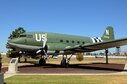 Few aircraft were as well known or widely used during the 1940s as the C-47 Douglas “Skytrain,” affectionately nicknamed “Gooney Bird.” The story of tail number N-2150761, the C-47 now on display in the Tinker Heritage Airpark, tells of the versatility of an aircraft that served its country well and the people who maintained it. The aircraft was based on the design of the Douglas DC-3 airliner, a commercial transport that appeared in 1936. The first C-47s were ordered in 1940 and, by the end of World War II, 9,348 had been 
procured for military use. Douglas Aircraft Company produced 5,354 C-47s and spare parts for 500 more at its Oklahoma City Plant. Following the end of the war, the plant became Bldg. 3001, which is part of the Oklahoma City Air Logistics Center today.

 

