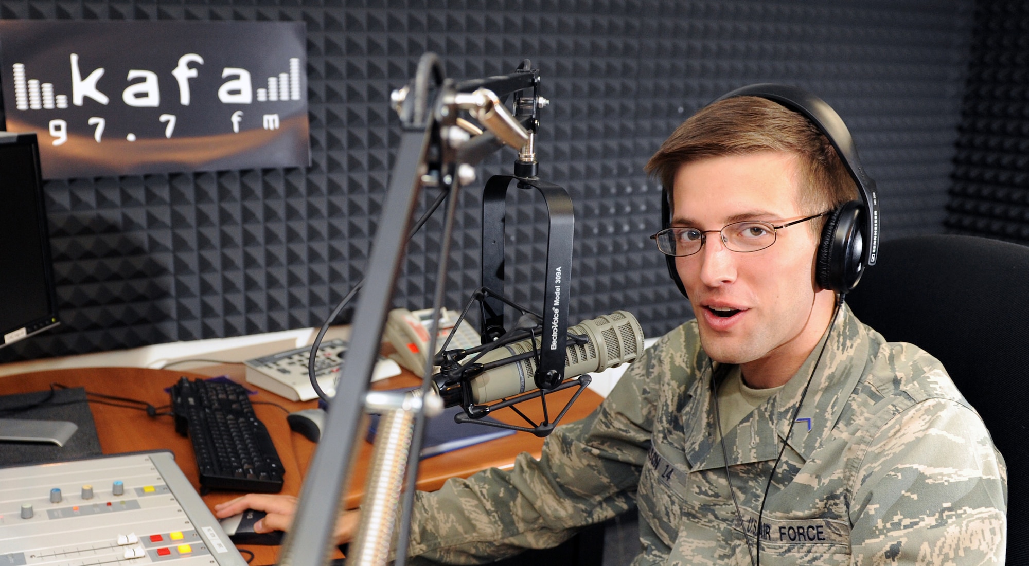 Cadet 3rd Class Cody Nelson, or DJ Sparky, plays tunes for listeners on 97.7 KAFA, the Academy's radio station. DJ Sparky is one of 24 cadets and five permanent party volunteer DJs who fill time on KAFA's airwaves. KAFA started in the early 70s and has continued to evolve from playing records to full automation capabilities. (U.S. Air Force photo/Tech. Sgt. Raymond Hoy)