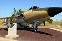 The F-105 Thunderchief was one of the most versatile tactical jet fighters in the Air Force inventory from 1959 through the Vietnam Era. Tinker’s representative F-105, a D-model named “Iron Duke” (serial number 62-4360), represents the accomplishments and contributions of Tinker Air Force Base employees, but has a story of its own to tell.  The F-105, affectionately known as the “Thud,” represented the future of fighter-bomber aircraft in 1958 when it entered operational service.  The F-105 could deliver 12,000 pounds of bombs, either conventional or nuclear, at supersonic speeds.   
This would be comparative to giving a World War II-era B-17 the capability to leave London at noon, drop bombs on Berlin at 1:00 p.m., and be home by 2 p.m., as well as be able to defend itself the entire flight. Within 15 years, fighter-bombers had come that far. The Thunderchief was a milestone, more maneuverable than a B-52 and capable of flying close overhead to support advancing ground forces.
 
