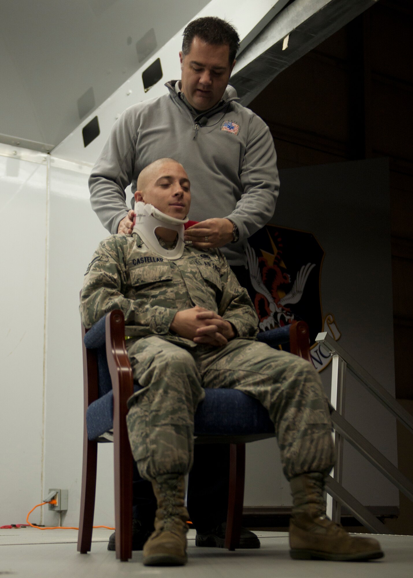Joseph McCluan, firefighter, paramedic and director from the S.A.F.E. (Stay Alive From Education) program, demonstrates on U.S. Air Force Airman 1st Class Joshua Castellar, 23rd Logistics Readiness Squadron, the medical procedures done when responding to a traumatic accident at Moody Air Force Base, Ga., Nov. 18, 2011. McCluan also shared stories of what he’s seen during his time as a paramedic, emphasizing that drinking, taking drugs or even texting while driving can end with fatalities or lifelong injuries. (U.S. Air Force photo by Senior Airman Eileen Meier/Released)