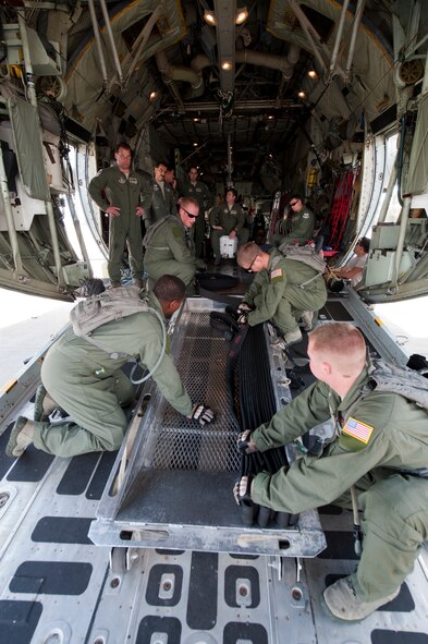 Participants in a forward area refueling point (FARP) training exercise reset gas hoses after performing a FARP drill on Moody Air Force Base, Ga., Nov. 15, 2011. A FARP is used to refuel aircraft that cannot perform in-flight refueling or make it to an airfield. Moody personnel are trained on FARP procedures to better support the personnel recovery missions around the globe. (U.S. Air Force photo by Staff Sgt. Joshua J. Garcia/Released)