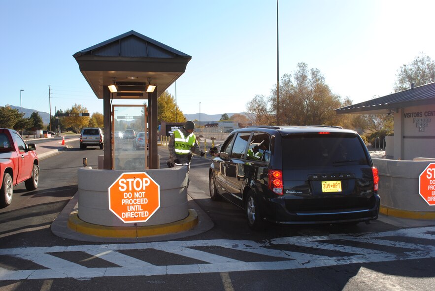 Senior Airman Justin Mongoso, 377th Security Forces Squadron, checks a driver’s identification card Thursday at the Gibson Gate. Beginning Nov. 28, the Gibson Gate and the Truman Gate will be open 24/7. Other gate hours will be as shown below.

By Stefan Bocchino