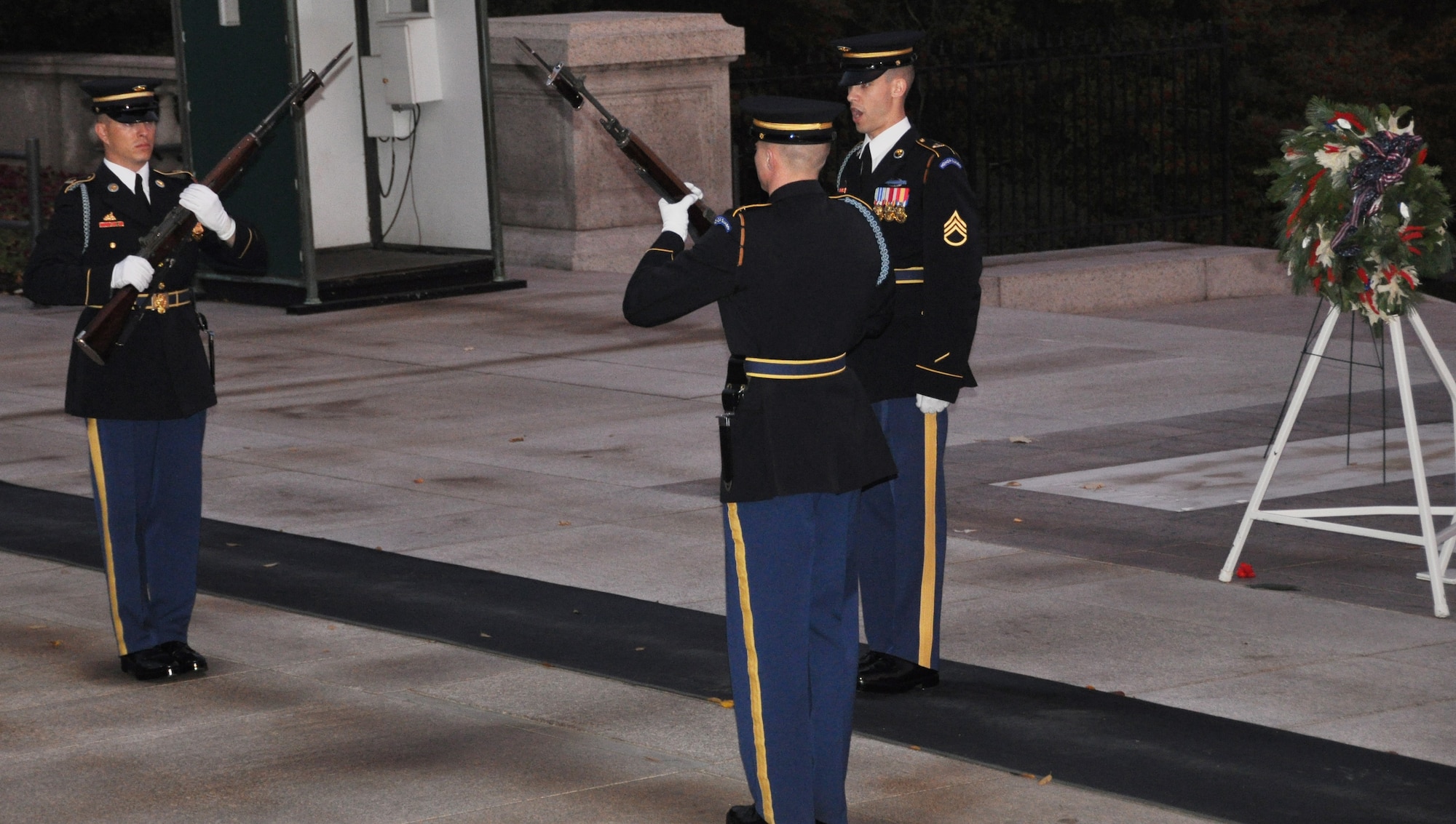 Three Honor Guard service members perform the last changing of the guard for the day at Arlington National Cemetery Nov. 14. (U.S. Air Force photo/Senior Airman Chelsea Smith)