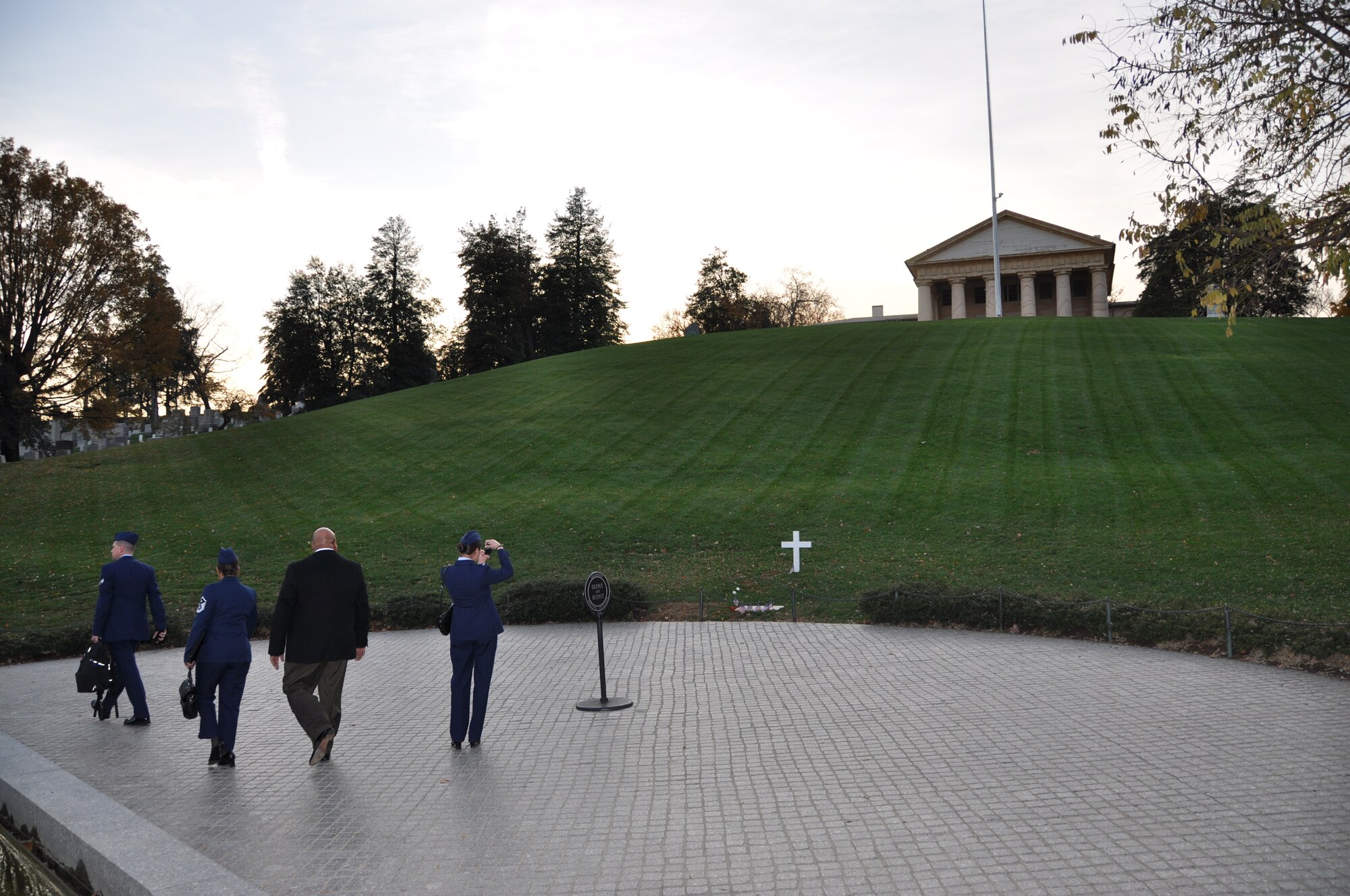 1st Lt. Brittany Hemmer, 94th Airlift Wing Aeromedical Evacuation Squadron flight nurse, stops to photograph former president John F. Kennedy’s tomb at Arlington National Cemetery Nov. 14. At the conclusion of the orientation course held at the Pentagon, attendees were able to visit numerous Washington, D.C. landmarks. (U.S. Air Force photo/Senior Airman Chelsea Smith)