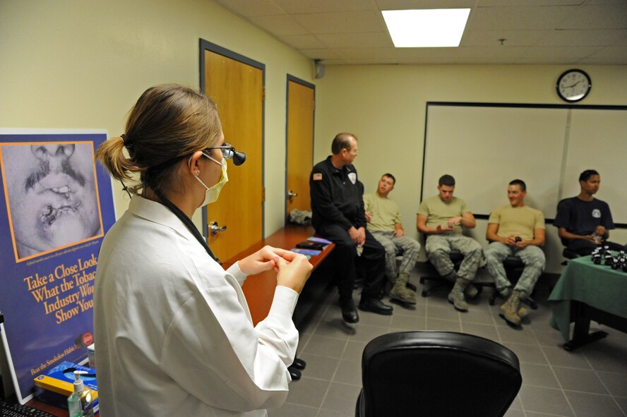 LAUGHLIN AIR FORCE BASE, Texas – Tech. Sgt. Kendra Lauruhn, 47th Medical Operations Squadron dental hygienist, prepares to perform oral cancer screenings Nov. 17 at the fire house here. Members of the medical squadron were out in support to the 36th Great American Smokeout to help and encourage tobacco users to stop smoking and chewing tobacco. (U.S. Air Force photo/Senior Airman Scott Saldukas)