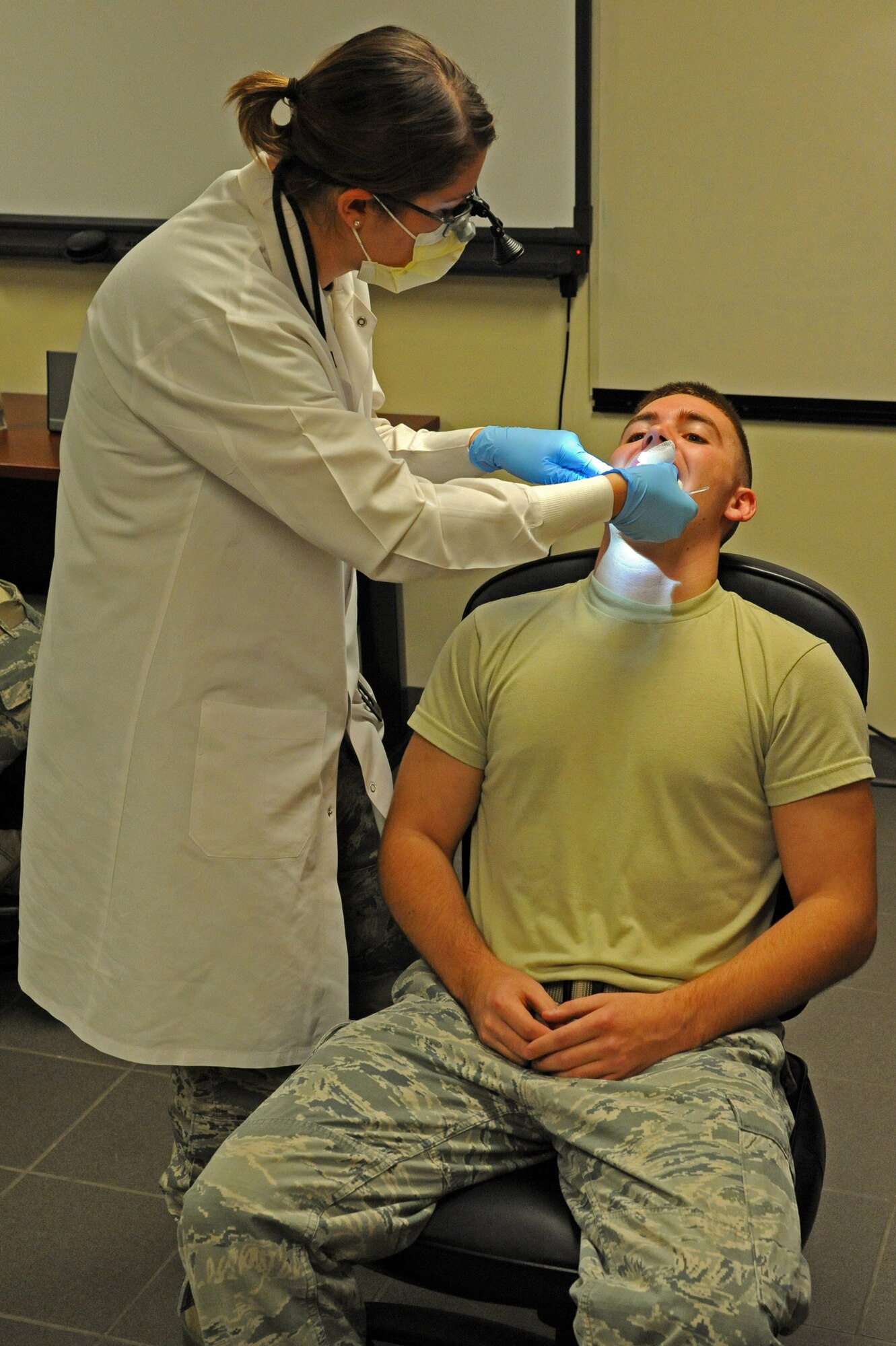 LAUGHLIN AIR FORCE BASE, Texas – Tech. Sgt. Kendra Lauruhn, 47th Medical Operations Squadron dental hygienist, performs an oral cancer screening on an Airman Nov. 17 at the fire house here. Members of the medical squadron were out in support to the 36th Great American Smokeout to help and encourage tobacco users to stop smoking and chewing tobacco. (U.S. Air Force photo/Senior Airman Scott Saldukas)