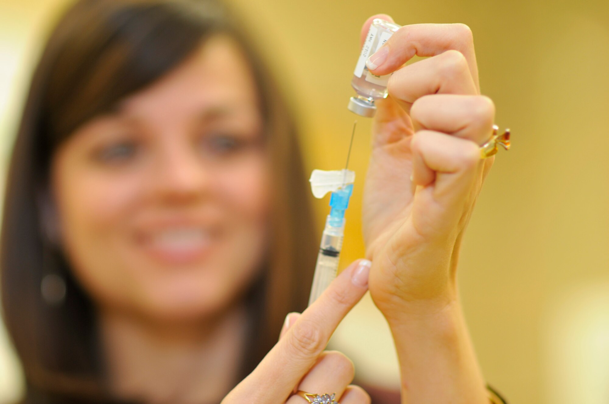 Jessica McNeese, nurse practitioner at the ATA/CORE Dispensary, prepares a flu shot for administration to a patient Nov. 3. (Photo by Rick Goodfriend)
