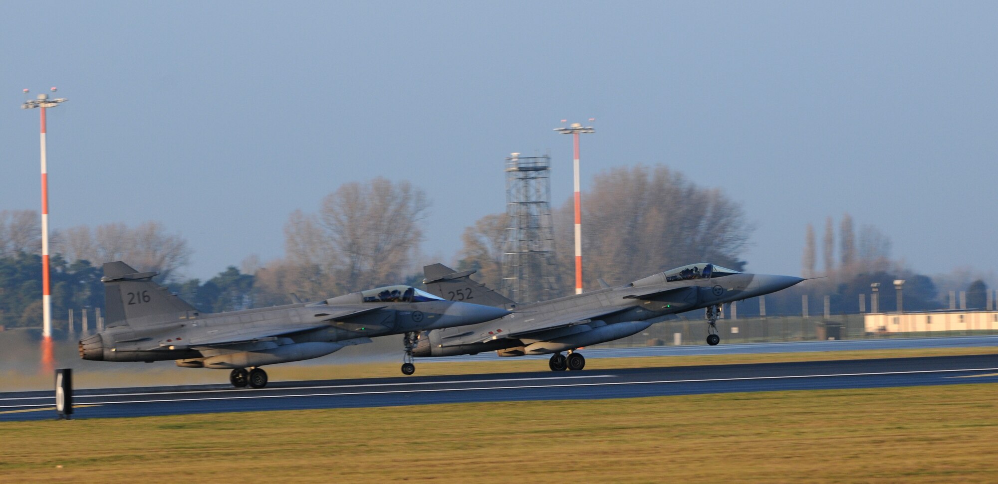 ROYAL AIR FORCE LAKENHEATH, England – Swedish Air Force JAS-39C Gripens from the 211th Fighter Squadron take off Nov. 17, 2011. Members from the SAF and 48th Fighter Wing trained together to increase their interoperability and gather experience with dissimilar aircraft. (U.S. Air Force photo by Airman 1st Class Cory D. Payne)