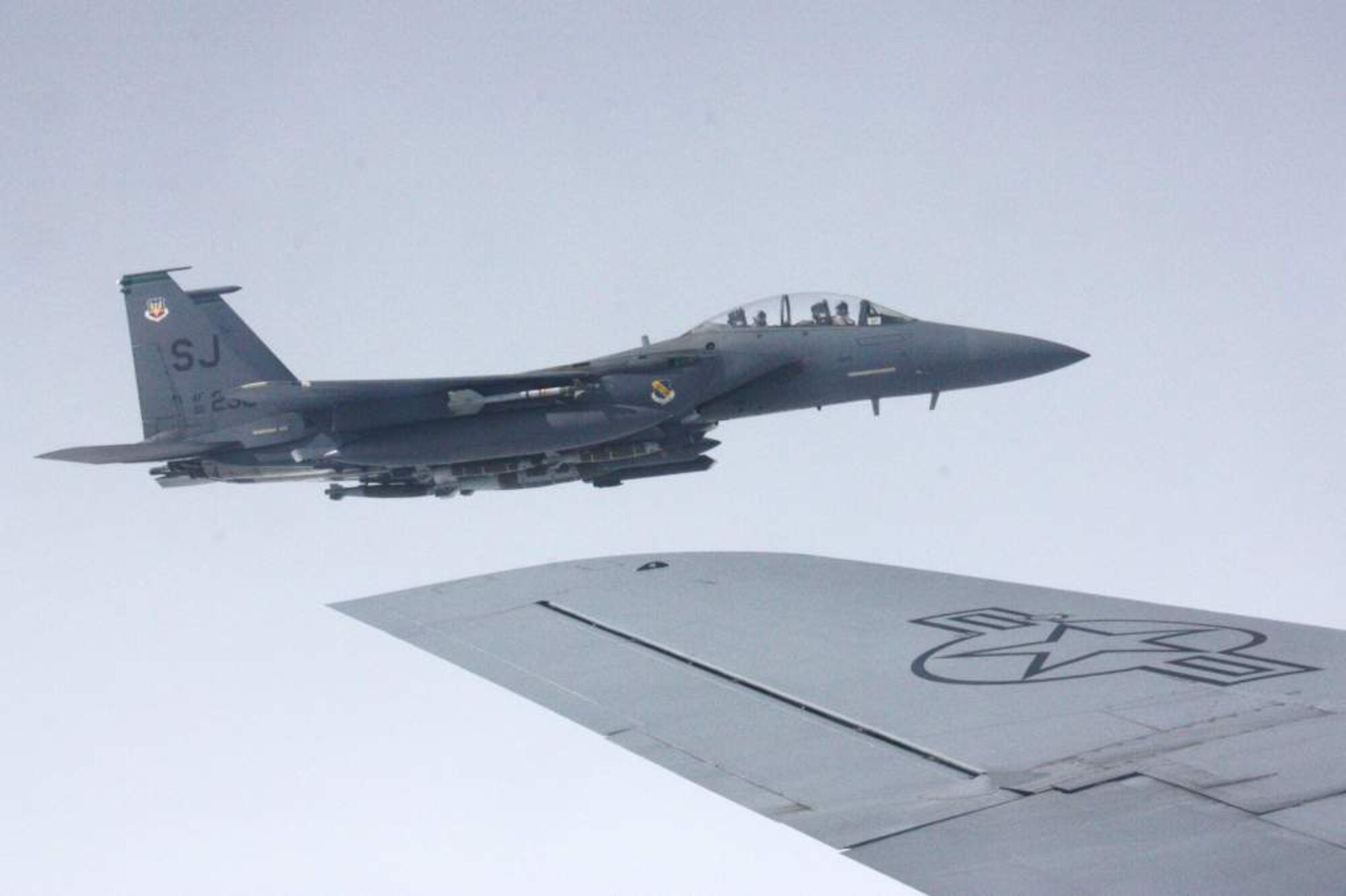 An F-15E Strike Eagle approaches a KC-135 Stratotanker for refueling over Afghanistan Nov. 18. An array of avionics and electronics systems gives the F-15E the capability to fight at low altitude, day or night, and in all weather, as well as the capability to fight its way to a target over long ranges, destroy enemy ground positions and fight its way out. The Stratotanker is deployed to the 22nd Expeditionary Air Refueling Squadron at the Transit Center at Manas, Kyrgyzstan, from the Alabama Air National Guard’s 117th Air Refueling Wing. The Strike Eagle is deployed from Seymour Johnson Air Force Base, N.C. (U.S. Air Force photo/Capt. Andrew Hardy)