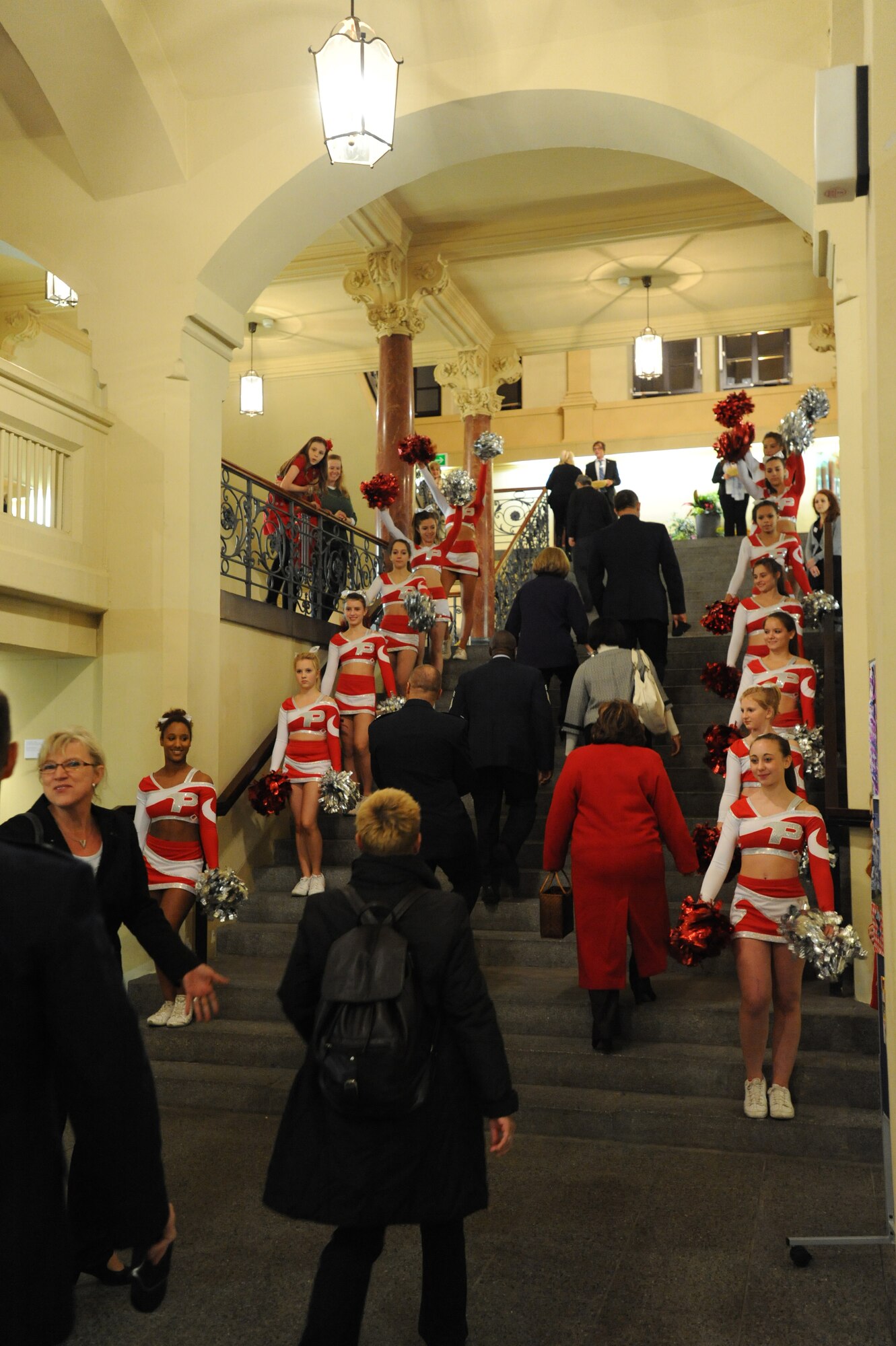 Pikes Cheerleading squad welcomes guests upon arrival during the ‘Year of Internationality’ event, Kaiserslautern, Germany, Nov.16, 2011. During the event individuals from the U.S. were given the opportunity to present information and share personal stories about their respective country to the local community. (Air Force photo by Airman 1st Class Caitlin O’Neil-McKeown)

