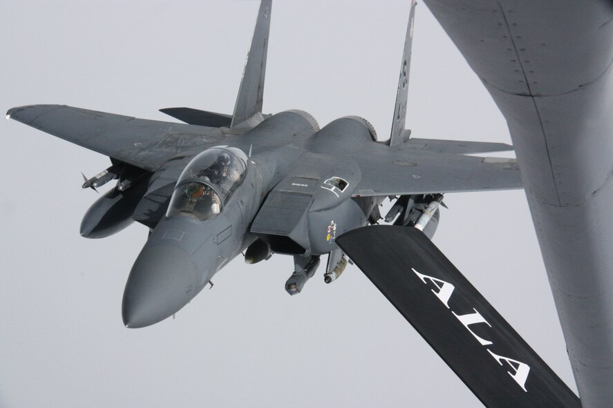 A KC-135 Stratotanker detaches after refueling an F-15 Strike Eagle over Afghanistan Nov. 18. International Security Assistance Force Commander, Gen. John Allen, witnessed the refueling during an orientation flight in the Strike Eagle. The Stratotanker is deployed to the 22nd Expeditionary Air Refueling Squadron at the Transit Center at Manas, Kyrgyzstan, from the Alabama Air National Guard’s 117th Air Refueling Wing. The Strike Eagle is deployed from Seymour Johnson Air Force Base, N.C. (U.S. Air Force photo/Capt. Andrew Hardy)