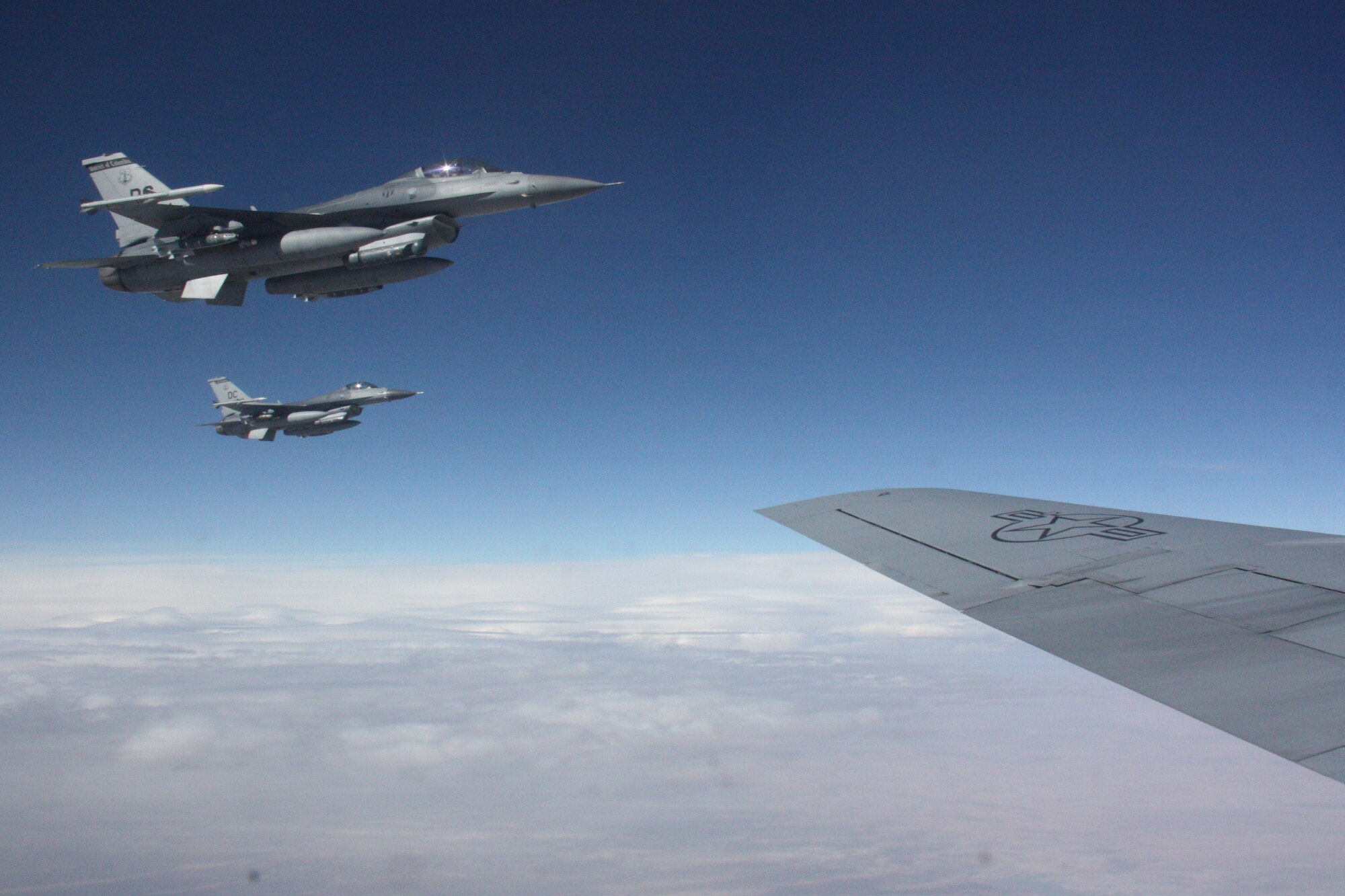 A pair of F-16 Fighting Falcons approach a KC-135 Stratotanker for refueling over Afghanistan Nov. 18. Since Sept. 11, 2001, the F-16 has been a major component of the combat forces committed to Operation Enduring Freedom. The Stratotanker is deployed to the 22nd Expeditionary Air Refueling Squadron at the Transit Center at Manas, Kyrgyzstan, from the Alabama Air National Guard’s 117th Air Refueling Wing. The Fighting Falcon is deployed from the D.C. Air National Guard’s 113th Wing. (U.S. Air Force photo/Capt. Andrew Hardy)