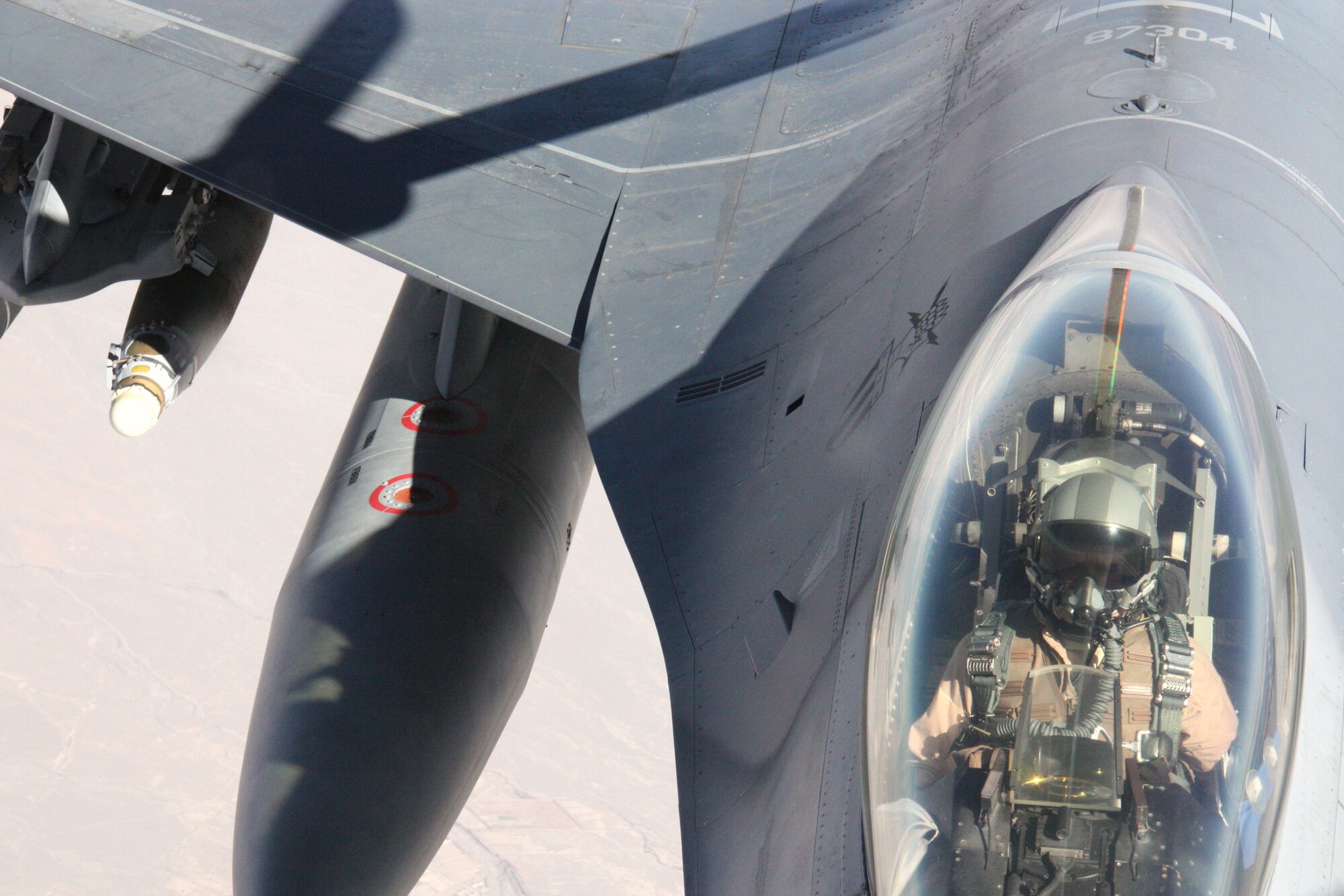 A KC-135 Stratotanker refuels an F-16 Fighting Falcon over Afghanistan Nov. 18. The F-16 is a compact, multi-role fighter aircraft. It is highly maneuverable and is proven in air-to-air combat and air-to-surface attack. The Stratotanker is deployed to the 22nd Expeditionary Air Refueling Squadron at the Transit Center at Manas, Kyrgyzstan, from the Alabama Air National Guard’s 117th Air Refueling Wing. The Fighting Falcon is deployed from the D.C. Air National Guard’s 113th Wing. (U.S. Air Force photo/Capt. Andrew Hardy)