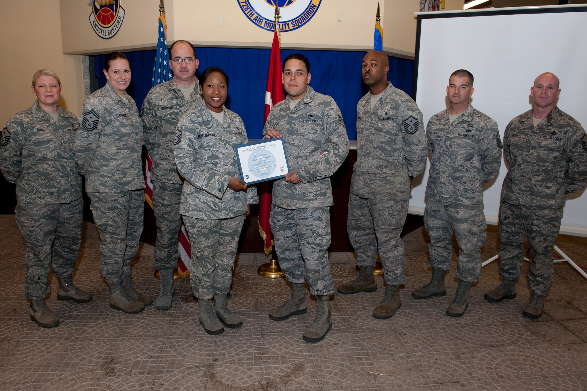 Tech. Sgt. Cesar Vargas, 728th Air Mobility Squadron, is presented the Diamond Sharp Award by members of the Incirlik First Sergeants Council Nov. 17, 2011, at Incirlik Air Base, Turkey. Vargas earned the monthly award for November by distinguishing himself through outstanding professionalism, performance and display of the Air Force core values. (U.S. Air Force photo by Tech. Sgt. Michael B. Keller/Released)