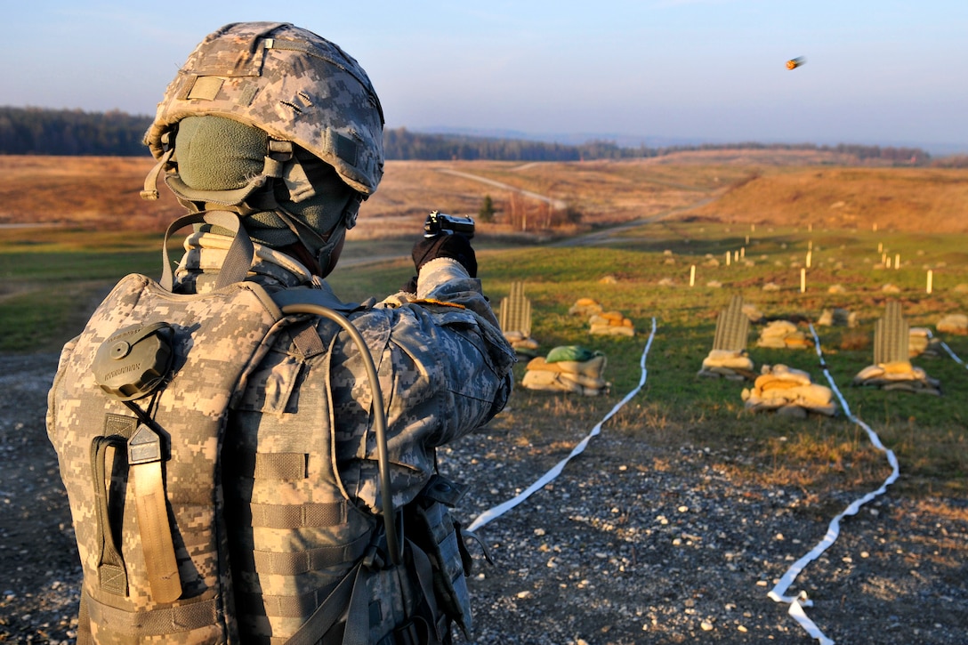 U.S. Army Cpt. Marie Hough fires an M9 Berreta during the pistol qualification portion of the U.S. Army Europe Best Junior Officer Competition on U.S. Army Garrison Grafenwoehr in Germany, Nov. 16, 2011. Hough is assigned to U.S. Army Europe, Headquarters Battalion. Officers from units throughout U.S. Army Europe competed in the grueling three-day event, which challenged the officers on warrior tasks and drills, decision making, problem solving and leadersip skills.