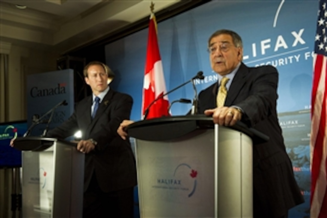 U.S. Defense Secretary Leon E. Panetta, right, and Canadian Defense Minister Peter MacKay hold a press conference to open the Halifax International Security Forum in Halifax, Nova Scotia, Nov. 18, 2011. Panetta and MacKay fielded several questions regarding the possible U.S. budget cuts to the F-35 strike fighter and it's impending impact on Canada. 