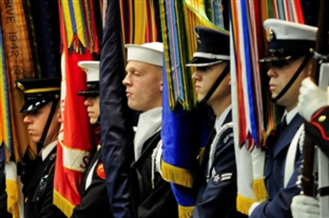 A color guard posts the colors during the Defense Logistics Agency change of responsibility and retirement ceremony on Fort Belvoir, Va., Nov. 18, 2011. Navy Vice Adm. Mark D. Harnitchek succeeded Navy Vice Adm. Alan S. Thompson as DLA director. 

