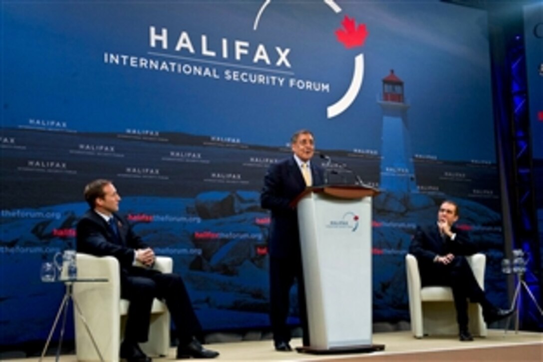 U.S. Defense Secretary Leon E. Panetta makes an opening statement as Canadian Defense Minister Peter MacKay, left, listens at the Halifax International Security Forum in Halifax, Nova Scotia, Nov. 18, 2011. Panetta stressed the importance of international alliances to help combat terrorist organizations worldwide.