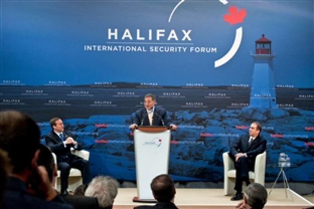 U.S. Defense Secretary Leon E. Panetta makes an opening statement as Canadian Defense Minister Peter MacKay, left, listens at the Halifax International Security Forum in Halifax, Nova Scotia, Nov. 18, 2011. Panetta stressed the importance of international alliances to help combat terrorist organizations worldwide.