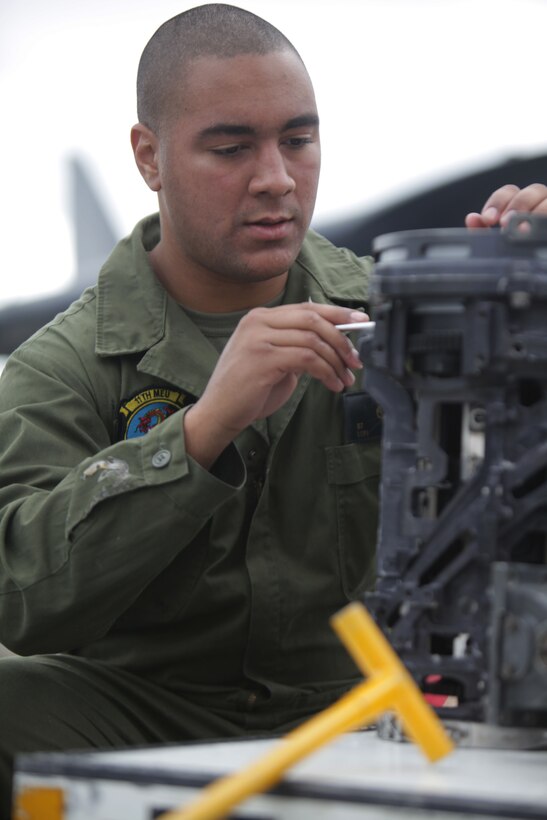 Lance Cpl. Sean Fitzpatrick applies grease to an AH-1Z Super Cobra 20mm machine gun aboard USS Makin Island here Nov. 16. Fitzpatrick, a 21-year-old Los Angeles native, is an aviation ordnance man with Marine Medium Helicopter Squadron 268 (Reinforced), the 11th Marine Expeditionary Unit’s aviation combat element. The unit embarked USS Makin Island, USS New Orleans and USS Pearl Harbor in San Diego Nov. 14 beginning a seven-month deployment through the Western Pacific and Middle East regions.