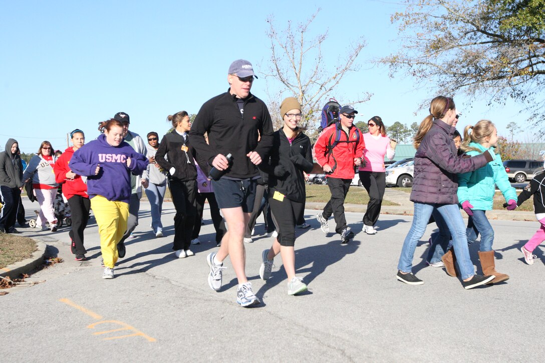 Runners take off at the start of the Tarawa Terrace November Fun Run, Saturday, at the Tarawa Terrace housing area aboard Marine Corps Base Camp Lejeune. ::r::::n::::r::::n::