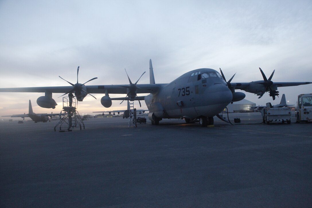 Marines maintain the Harvest Hawk equipped KC-130J Hercules after landing at Kandahar Airfield, Afghanistan, Nov. 19.  The Harvest Hawk system adds close-air support to the long list of capabilities, including aerial refueling and battlefield illumination, of the Marine Corps’ largest aircraft. To learn more about Marines in Afghanistan, join them at http://www.facebook.com/regionalcommandsouthwest.