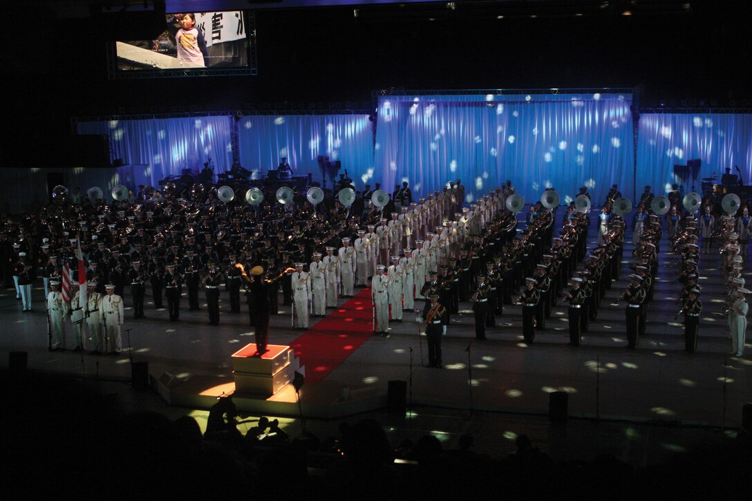 The Japan and U.S. colors are marched into the arena during the Japan Self-Defense Force Music Festival held at the Nippon Budokan Arena in Tokyo Nov. 19. The bands participating included members of the III Marine Expeditionary Force Band, Japan Ground Self-Defense Force Central Band, Japan Air Self-Defense Force Central Band, Japan Maritime Self-Defense Force Central Band and the U.S. Army Japan Band, along with civilian musicians.