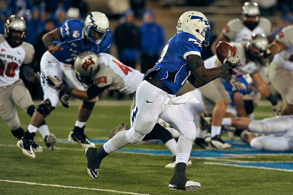 Air Force running back Asher Clark takes a pitch from quarterback Tim Jefferson in the Air Force-UNLV game Nov. 19, 2011. Clark, a senior and native of Lawrenceville, Ga., became Air Force's second-leading all-time rusher with 169 yards and a touchdown on 15 carries. (U.S. Air Force photo/Bill Evans)