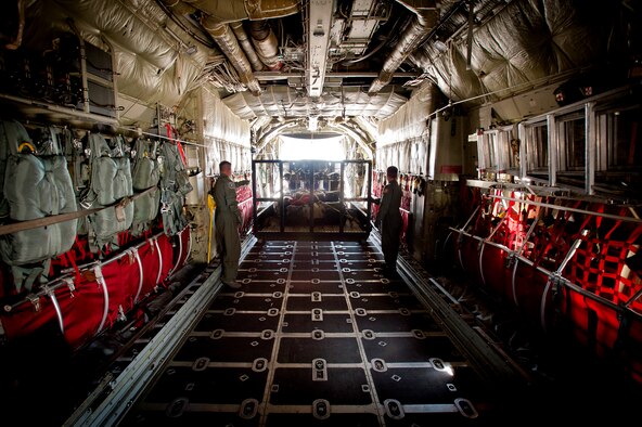 Loadmasters from the 165th Airlift Squadron guide a truck and trailer packed with rescue gear onto a Kentucky Air Guard C-130 as Airmen prepare to deploy Sept. 28, 2011, from Louisville, Ky., to Joint Base McGuire-Dix-Lakehurst, N.J., where they were expected to stage for rescue operations in the aftermath of Hurricane Irene. The deployment was called off just prior to the Airmen's departure when damage from Irene was found to be less extensive than anticipated. (U.S. Air Force photo by Maj. Dale Greer)