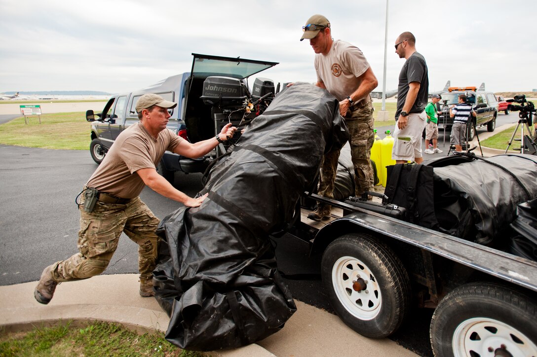 Members of the Kentucky Air National Guard’s 123rd Special Tactics Squadron load Zodiac motorboats onto a trailer as the unit prepares to deploy Sept. 28, 2011, from Louisville, Ky., to Joint Base McGuire-Dix-Lakehurst, N.J., where they were expected to stage for rescue operations in the aftermath of Hurricane Irene. The deployment was called off just prior to the Airmen's departure when damage from Irene was found to be less extensive than anticipated. Pararescuemen for the 123rd STS are trained to conduct a variety recovery missions and provide emergency medical care. They deploy with a range of dedicated rescue equipment like Zodiac motorboats in order to carry out a broad spectrum of operations. The 123rd STS has been instrumental in hurricane recovery operations before, conducting rescue missions and operating a helicopter landing zone in New Orleans that airlifted more than 11,000 people to safety following Hurricane Katrina in 2005. (U.S. Air Force photo by Maj. Dale Greer)