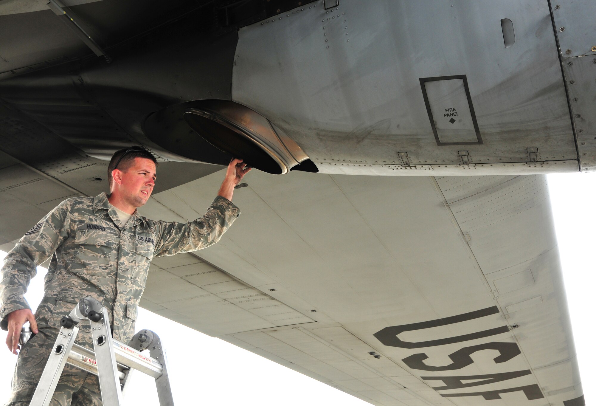 Tech. Sgt. Greg Howard, a crew chief for the Kentucky Air National Guard's 123rd Aircraft Maintenance Squadron, examines an engine on a C-130 aircraft in Anchorage, Alaska, July 10, 2011. The aircraft and aircrew were in Alaska to transport a communications truck to Wisconsin as part of Operation Joint Patriot. (U.S. Air Force photo by Staff Sgt. Jason Ketterer)